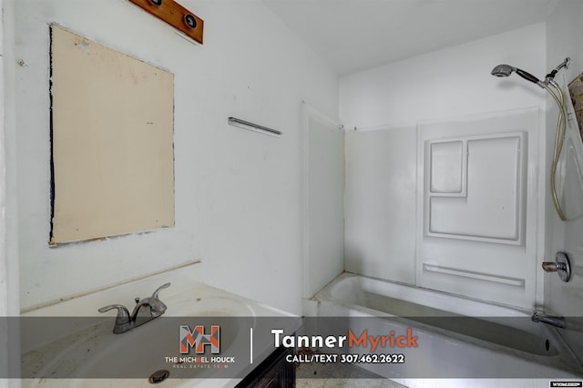 full bathroom featuring bathtub / shower combination and vanity