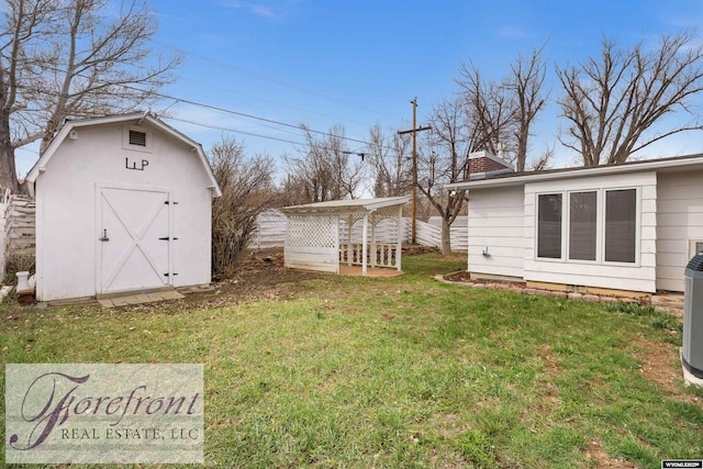 view of yard with a shed and an outdoor structure