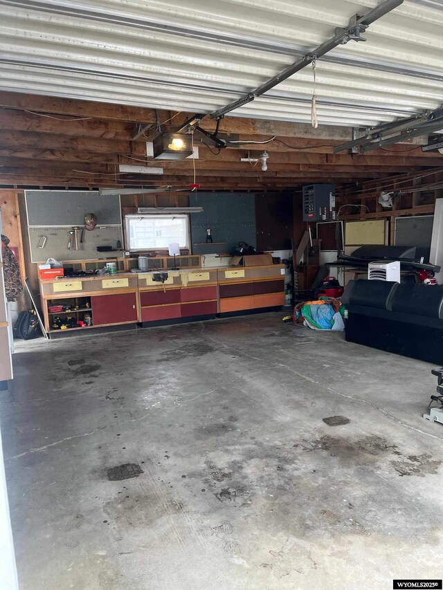 garage featuring a workshop area and a garage door opener