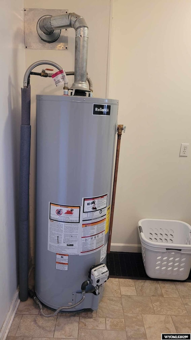 utility room featuring water heater