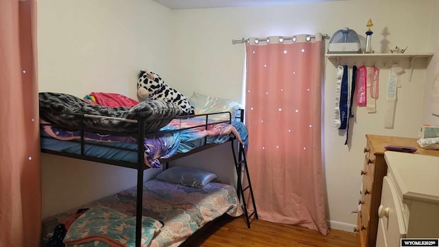 bedroom with wood finished floors