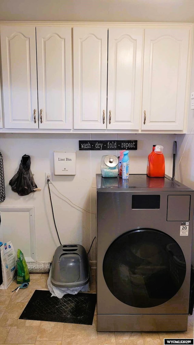 laundry area with washer / dryer and cabinet space