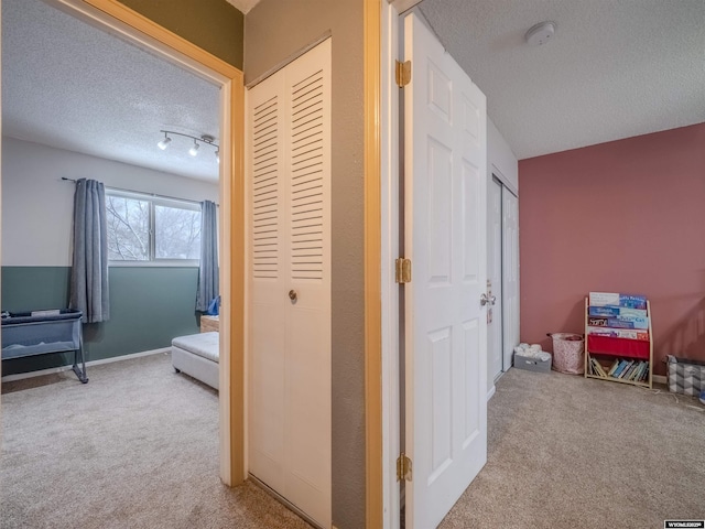 347 Copper, Evansville, WY 82636 - hallway with baseboards, carpet floors, and a textured ceiling