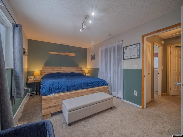 347 Copper, Evansville, WY 82636 - carpeted bedroom with baseboards and a textured ceiling