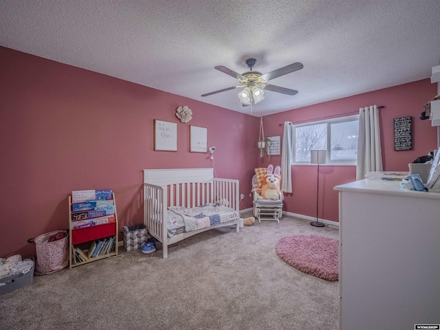 347 Copper, Evansville, WY 82636 - carpeted bedroom with a nursery area, a ceiling fan, and a textured ceiling