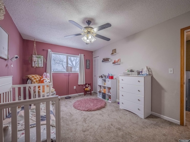 347 Copper, Evansville, WY 82636 - bedroom featuring a ceiling fan, carpet, baseboards, and a textured ceiling