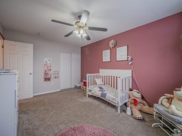 347 Copper, Evansville, WY 82636 - bedroom with carpet, baseboards, ceiling fan, a closet, and a textured ceiling