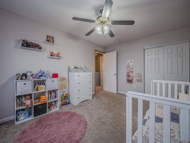 347 Copper, Evansville, WY 82636 - carpeted bedroom featuring a closet, baseboards, a textured ceiling, and a ceiling fan