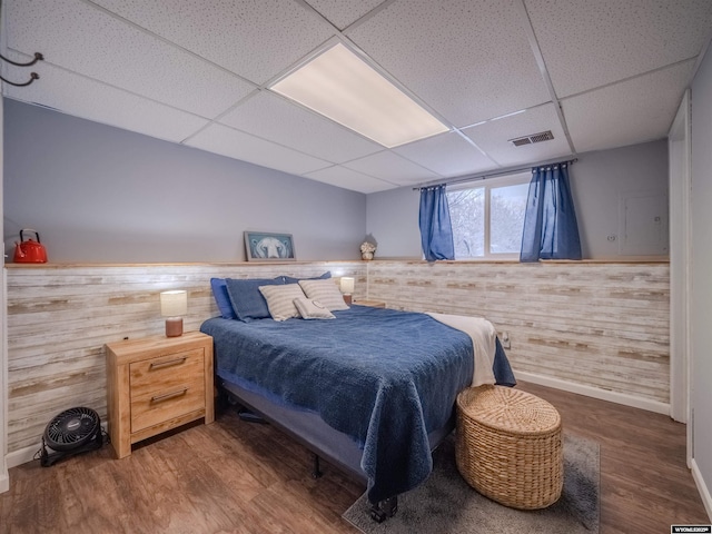347 Copper, Evansville, WY 82636 - bedroom with visible vents, a paneled ceiling, a wainscoted wall, and wood finished floors