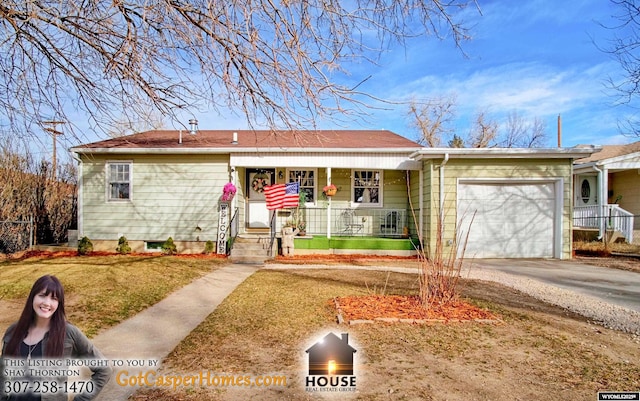 ranch-style house featuring concrete driveway, an attached garage, and covered porch