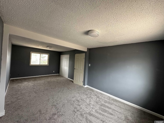 3649 Campbell Dr, Torrington, WY 82240 - carpeted empty room with baseboards and a textured ceiling