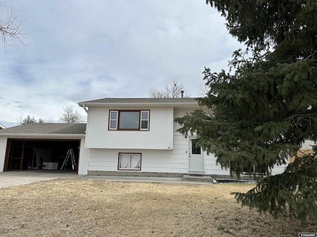 3649 Campbell Dr, Torrington, WY 82240 - view of front facade featuring concrete driveway, a garage, and entry steps
