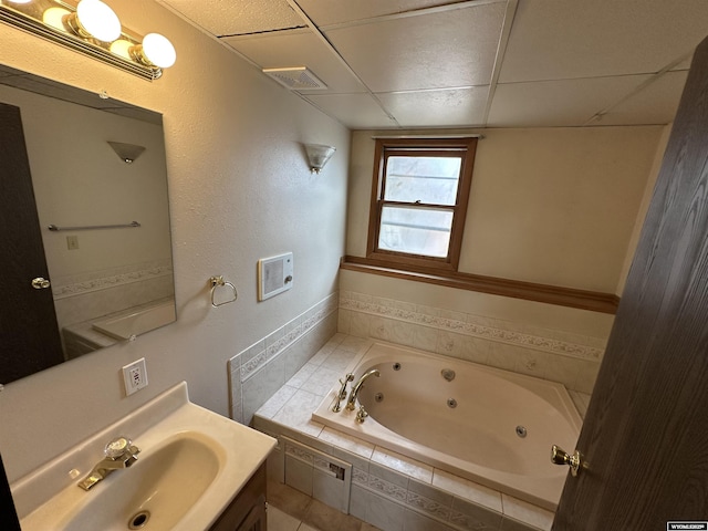3649 Campbell Dr, Torrington, WY 82240 - full bath featuring a tub with jets, visible vents, vanity, and a drop ceiling