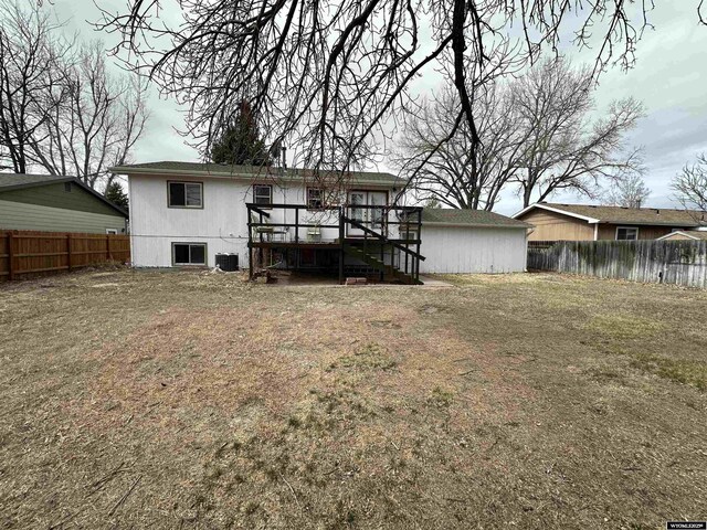 3649 Campbell Dr, Torrington, WY 82240 - rear view of property with a fenced backyard and central AC