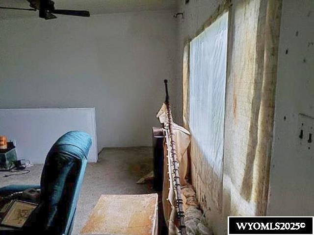 175 3rd Ave, Lusk, WY 82225 - carpeted bedroom with a ceiling fan