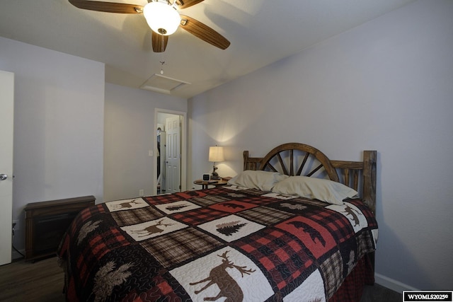 bedroom with attic access and ceiling fan