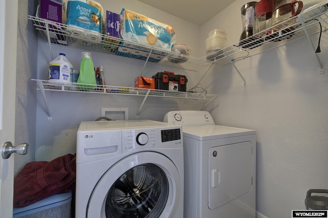laundry room featuring washer and dryer and laundry area