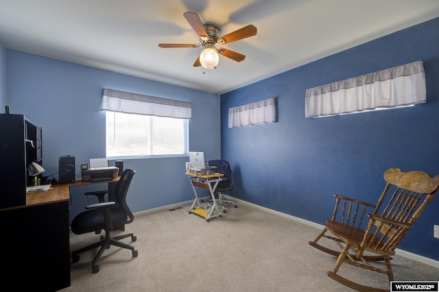 office space with ceiling fan, carpet floors, and baseboards