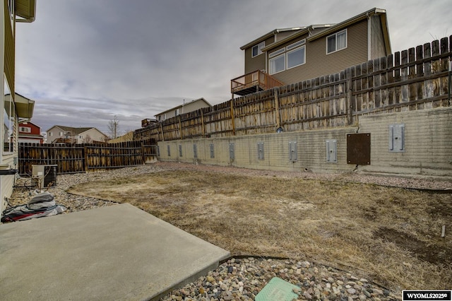 view of yard with a patio area and a fenced backyard