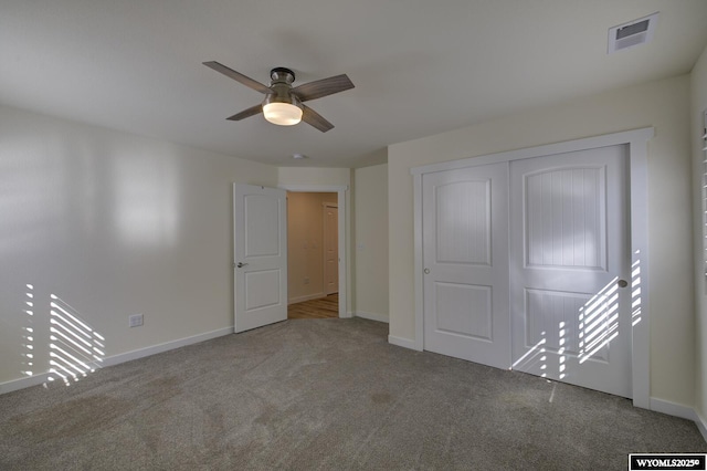 2087 Basswood St, Casper, WY 82604 - unfurnished bedroom featuring a closet, visible vents, baseboards, a ceiling fan, and carpet floors