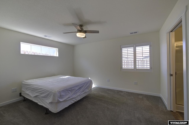 2087 Basswood St, Casper, WY 82604 - carpeted bedroom with baseboards, ceiling fan, and visible vents