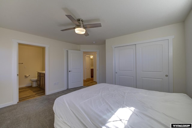 2087 Basswood St, Casper, WY 82604 - carpeted bedroom with a closet, ensuite bath, baseboards, and a ceiling fan