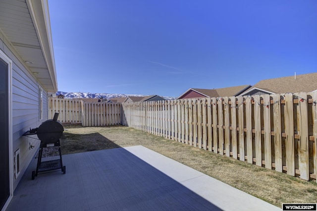 2087 Basswood St, Casper, WY 82604 - view of patio with a grill and a fenced backyard