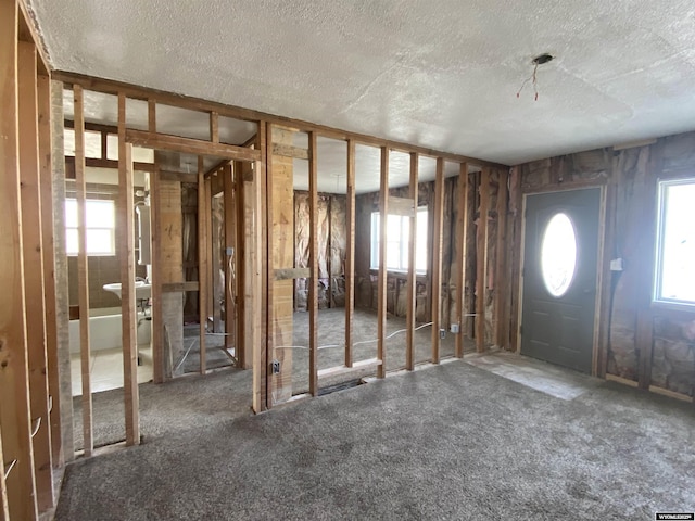 entrance foyer featuring a textured ceiling