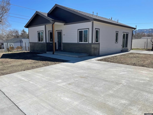ranch-style house with fence