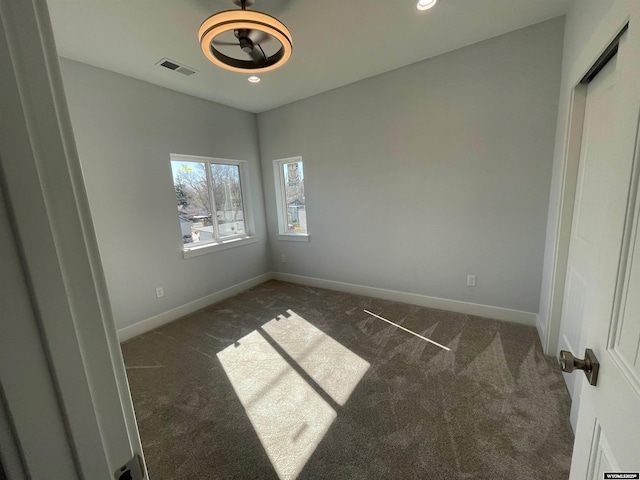 spare room with baseboards, carpet flooring, visible vents, and recessed lighting