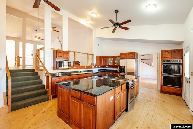 94 Upper Clear Creek Rd, Buffalo, WY 82834 - kitchen featuring light wood-style flooring, a kitchen island, stainless steel appliances, and ceiling fan