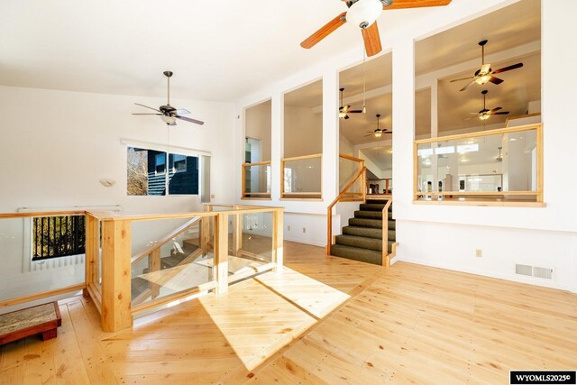 94 Upper Clear Creek Rd, Buffalo, WY 82834 - living room featuring hardwood / wood-style floors, visible vents, vaulted ceiling, and a ceiling fan