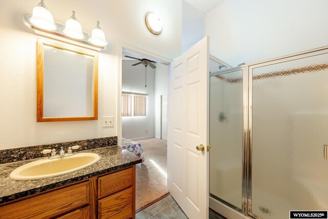 94 Upper Clear Creek Rd, Buffalo, WY 82834 - full bathroom featuring vanity, ceiling fan, and a shower stall