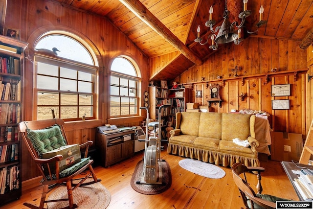 living area featuring wood ceiling, vaulted ceiling with beams, wooden walls, and light wood-type flooring