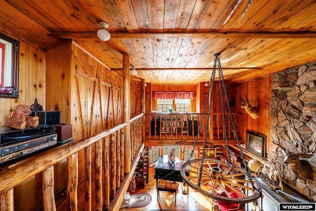 corridor featuring wood walls and wood ceiling