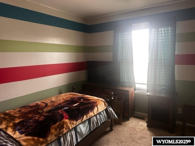 bedroom with light colored carpet