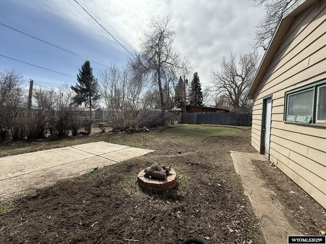 655 Amoretti St, Lander, WY 82520 - view of yard featuring a patio area, an outdoor fire pit, and fence