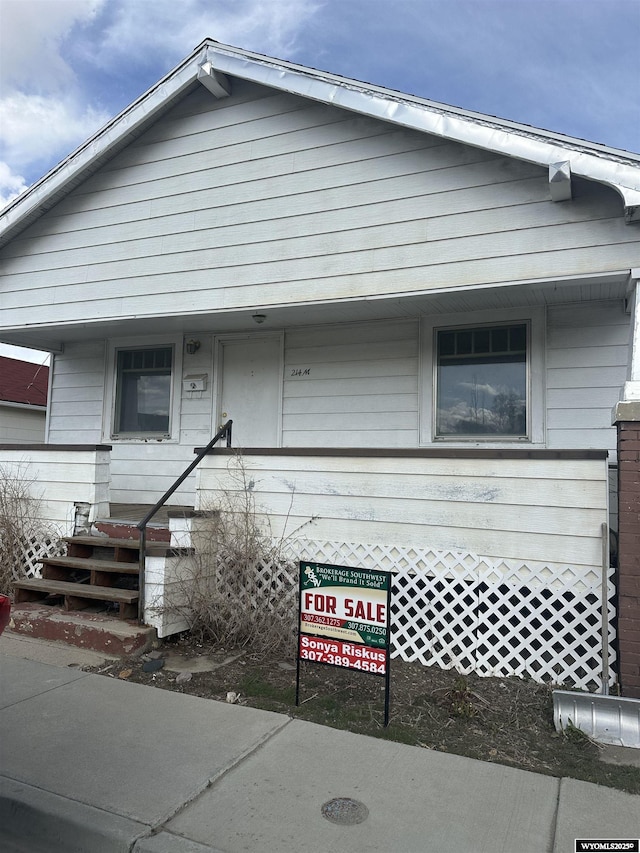214 M St, Rock Springs, WY 82901 - view of front of house featuring covered porch