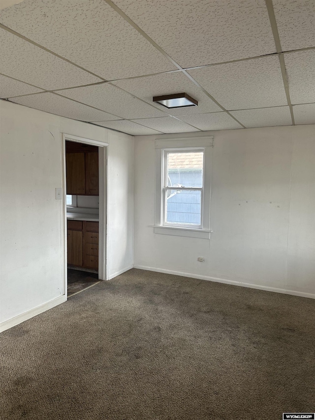 214 M St, Rock Springs, WY 82901 - carpeted spare room featuring baseboards and a drop ceiling