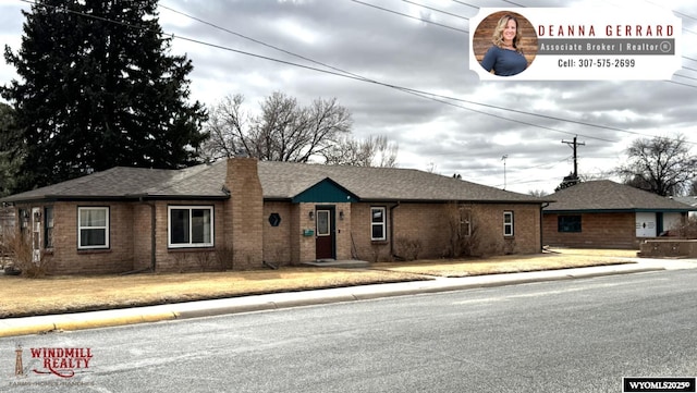 2842 Main St, Torrington, WY 82240 - ranch-style house with brick siding and a shingled roof