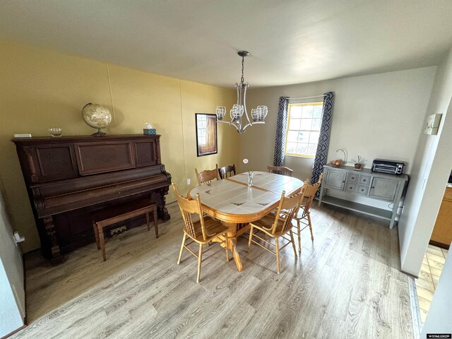2842 Main St, Torrington, WY 82240 - dining area with an inviting chandelier and light wood-style flooring