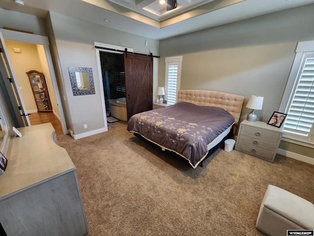 303 Tamarack Dr, Rock Springs, WY 82901 - carpeted bedroom with baseboards, a barn door, and recessed lighting