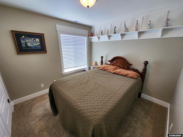 303 Tamarack Dr, Rock Springs, WY 82901 - carpeted bedroom featuring baseboards