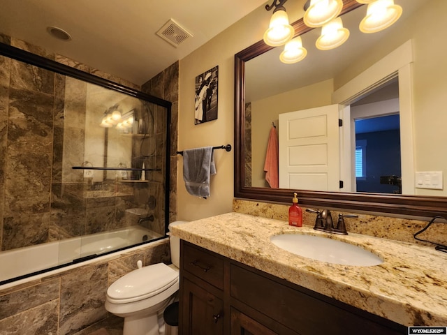303 Tamarack Dr, Rock Springs, WY 82901 - bathroom with tiled shower / bath combo, toilet, vanity, and visible vents