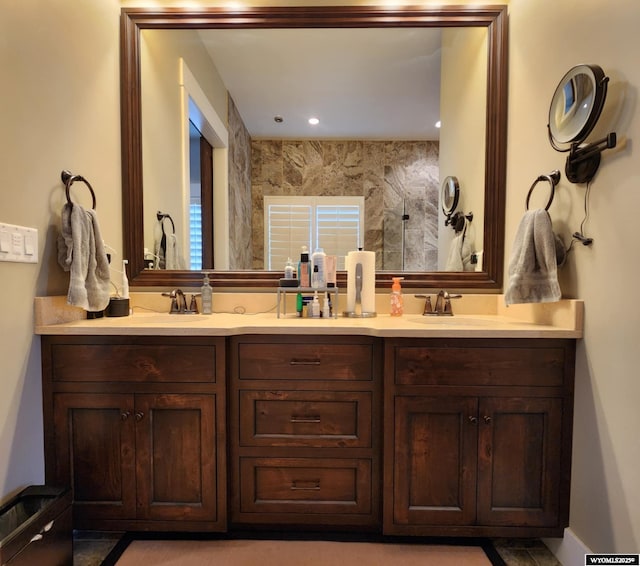 303 Tamarack Dr, Rock Springs, WY 82901 - bathroom with double vanity, a sink, and a shower