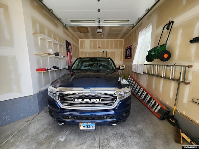 303 Tamarack Dr, Rock Springs, WY 82901 - garage featuring a garage door opener