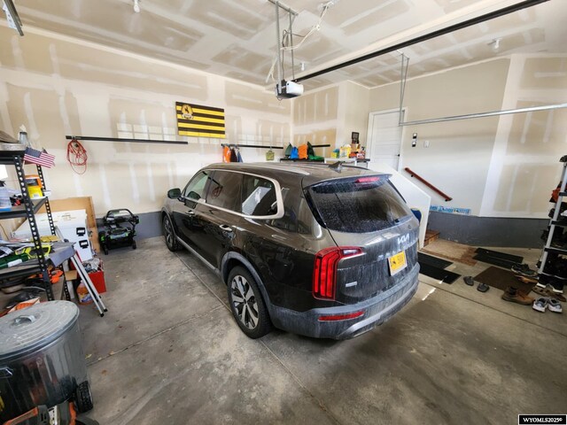 303 Tamarack Dr, Rock Springs, WY 82901 - garage featuring a garage door opener