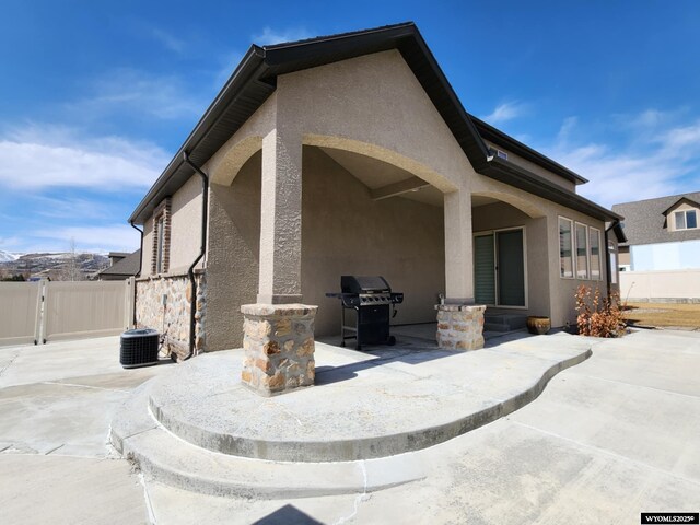 303 Tamarack Dr, Rock Springs, WY 82901 - exterior space featuring a grill, fence, and a gate