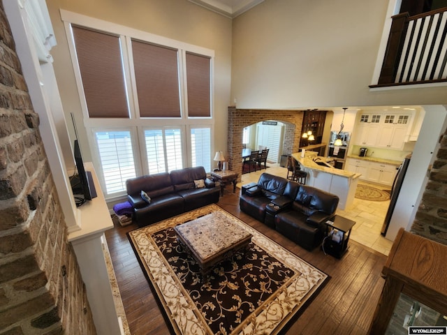 303 Tamarack Dr, Rock Springs, WY 82901 - living room featuring arched walkways and wood-type flooring