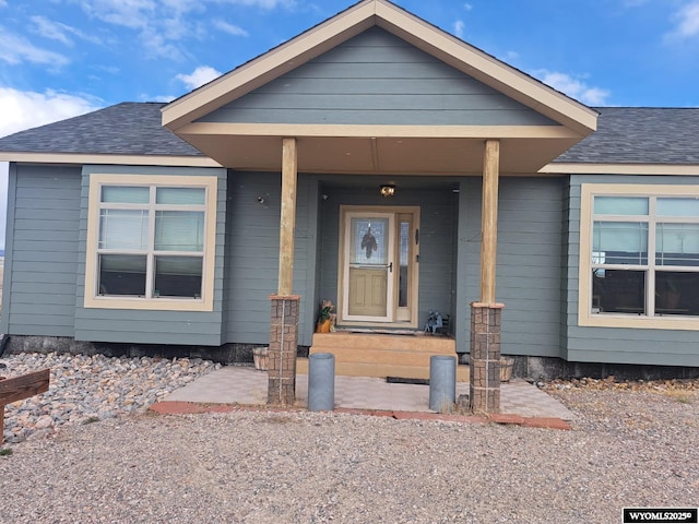 37 Winchester Rd, Guernsey, WY 82214 - view of front of home with a shingled roof and covered porch